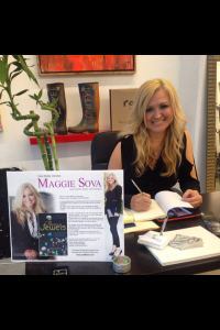 Maggie Jalufka Sova signs copies of "Precious Jewels " at a recent book signing.