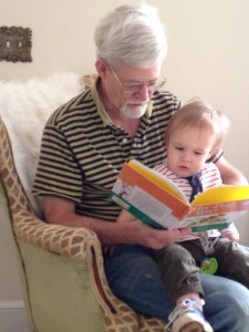 John shares his love of reading with his grandson.